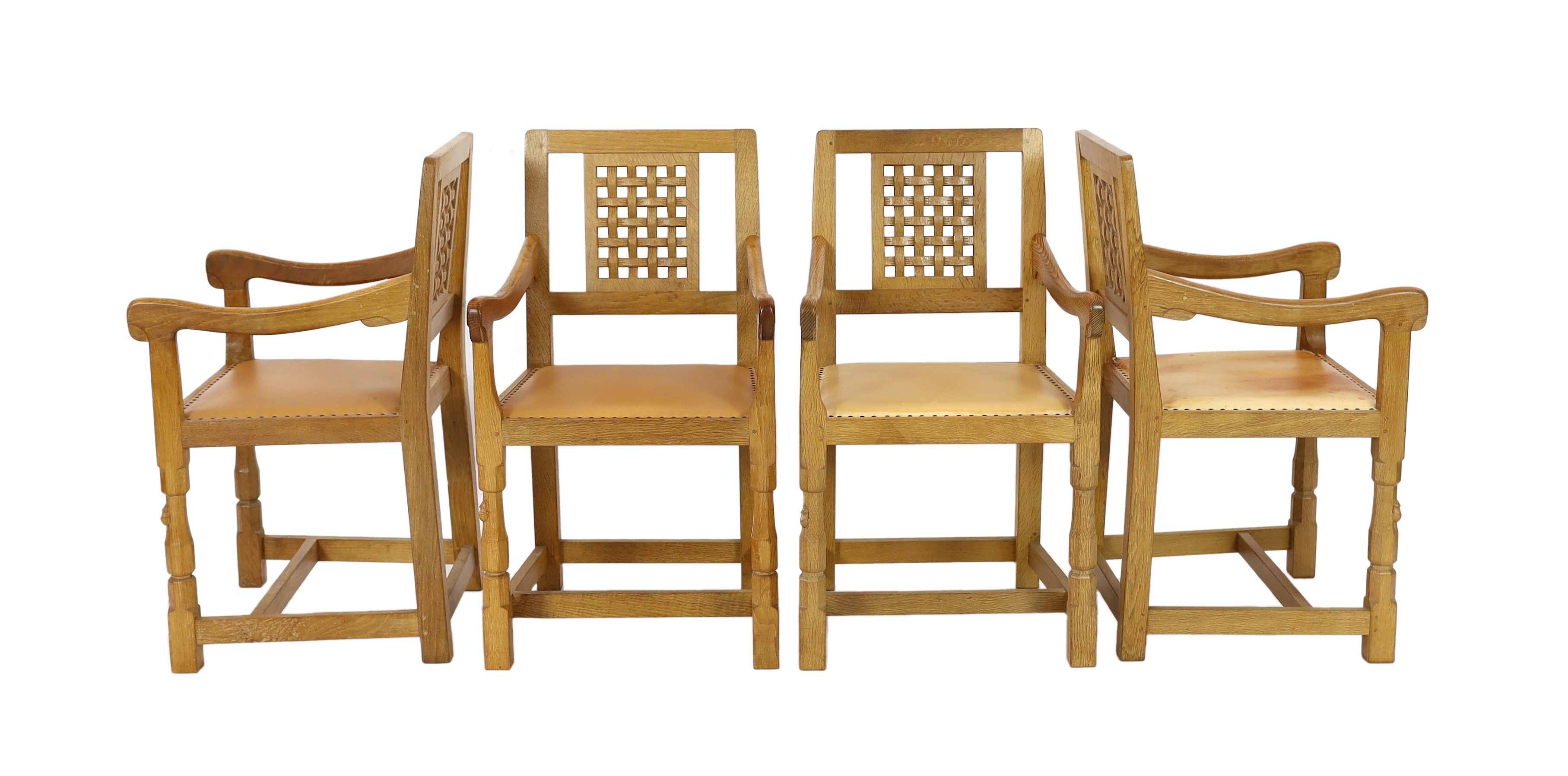 A set of four Robert Thompson 'Mouseman' oak armchairs W.52cm D.52cm H.90cm